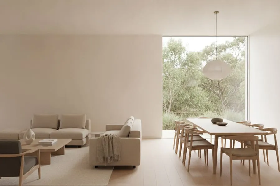 An open living and dining room in soft neutral tones.